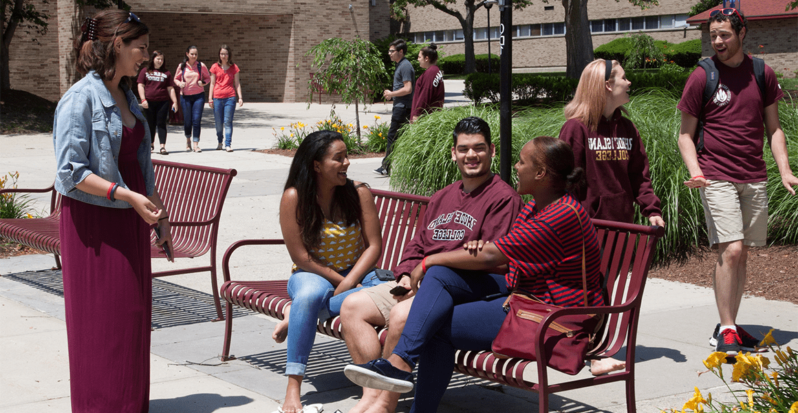 Students walking to class and chatting on the quad