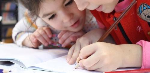 Two little girls studying